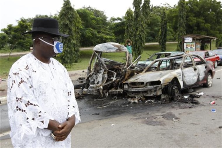 Two car bombs blew up on Friday as Nigeria celebrated its 50th independence anniversary, killing a number of people in an unprecedented attack on the capital by suspected militants from the country's oil region. 